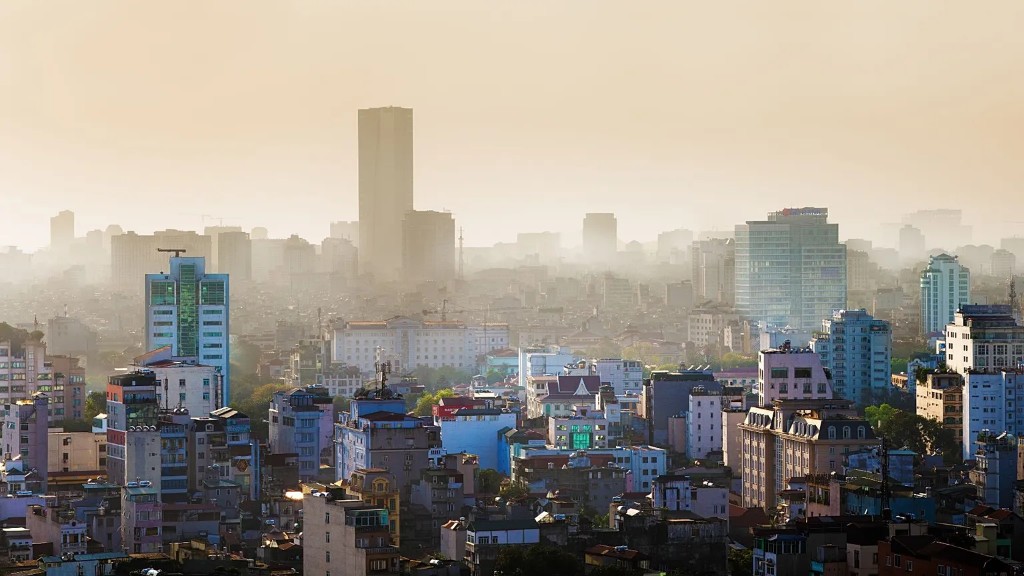 A dense Southeast Asian city skyline in hazy light, illustrating the urban scale at which compliance LRM programs operate